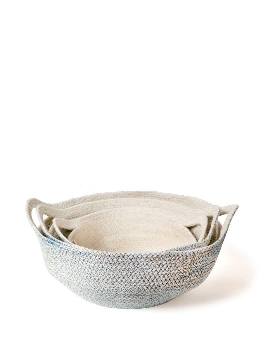 ALARA LOFTHandwoven off-white jute baskets with blue stitching, set of 3, for storage or display.